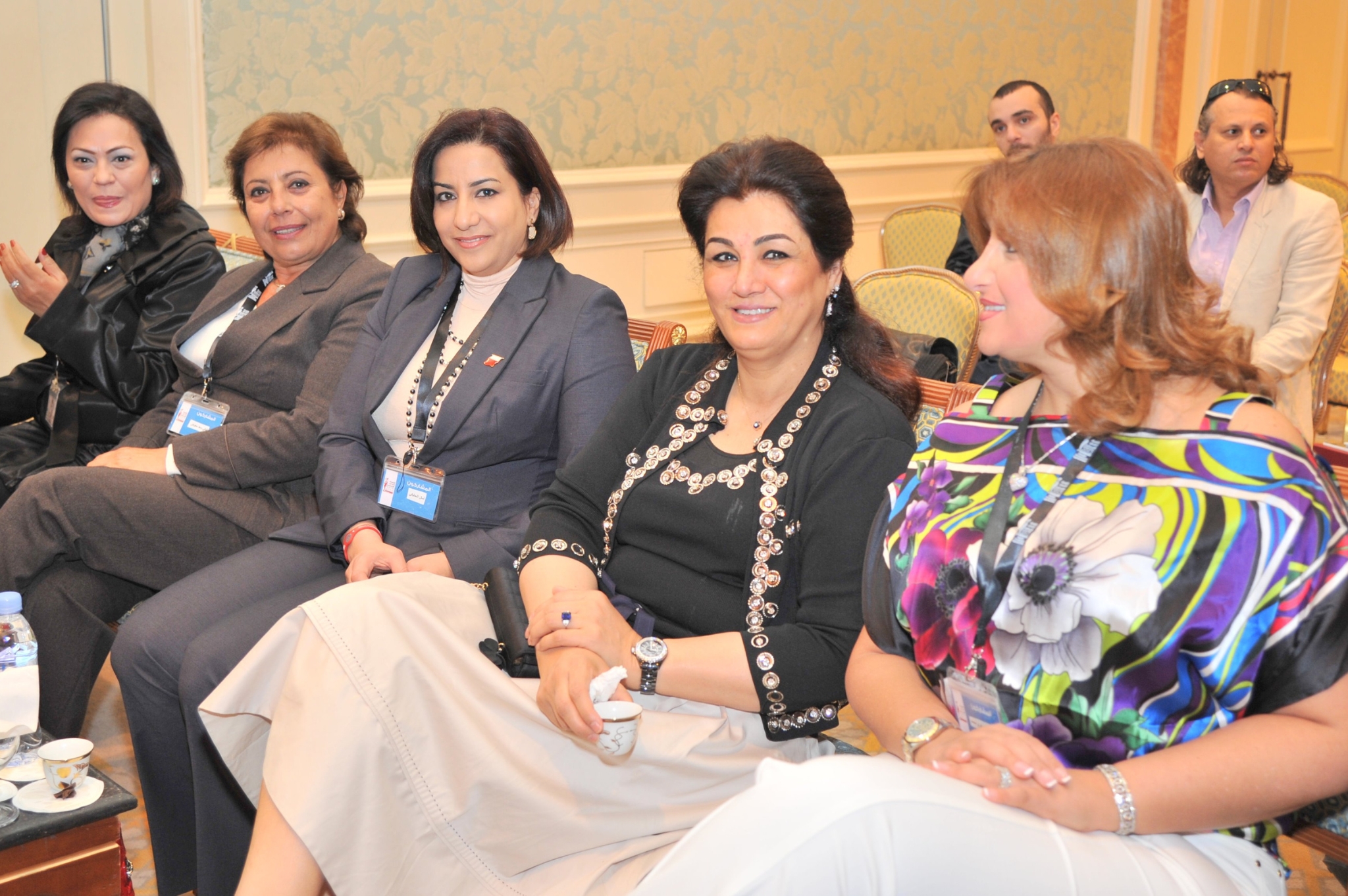 Curving forest road lined with tall pines.