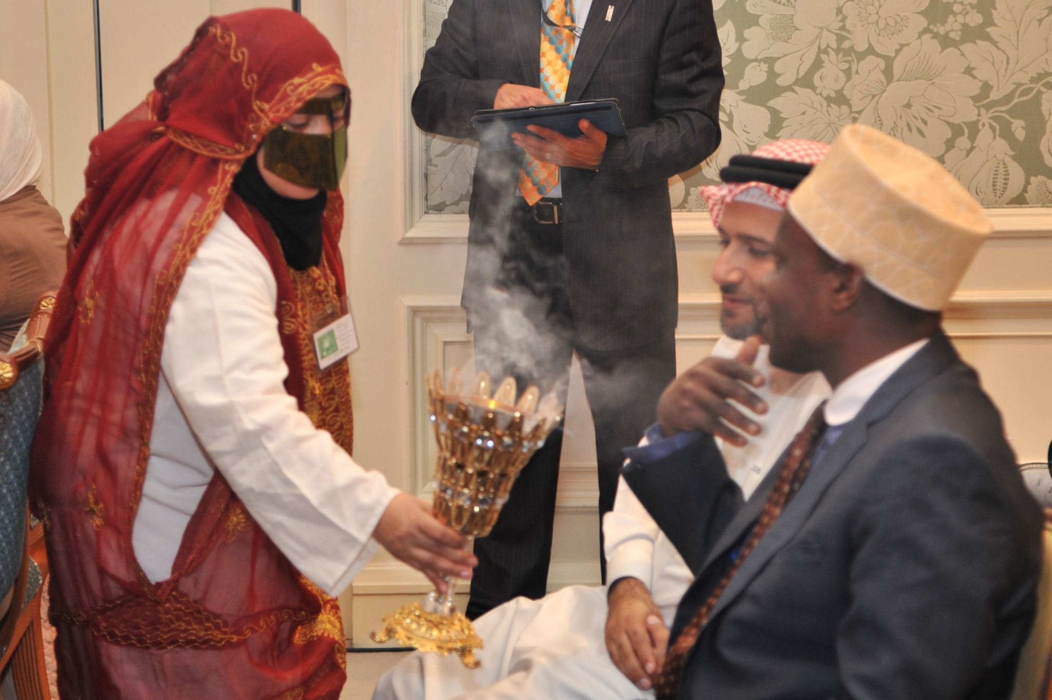 Curving forest road lined with tall pines.