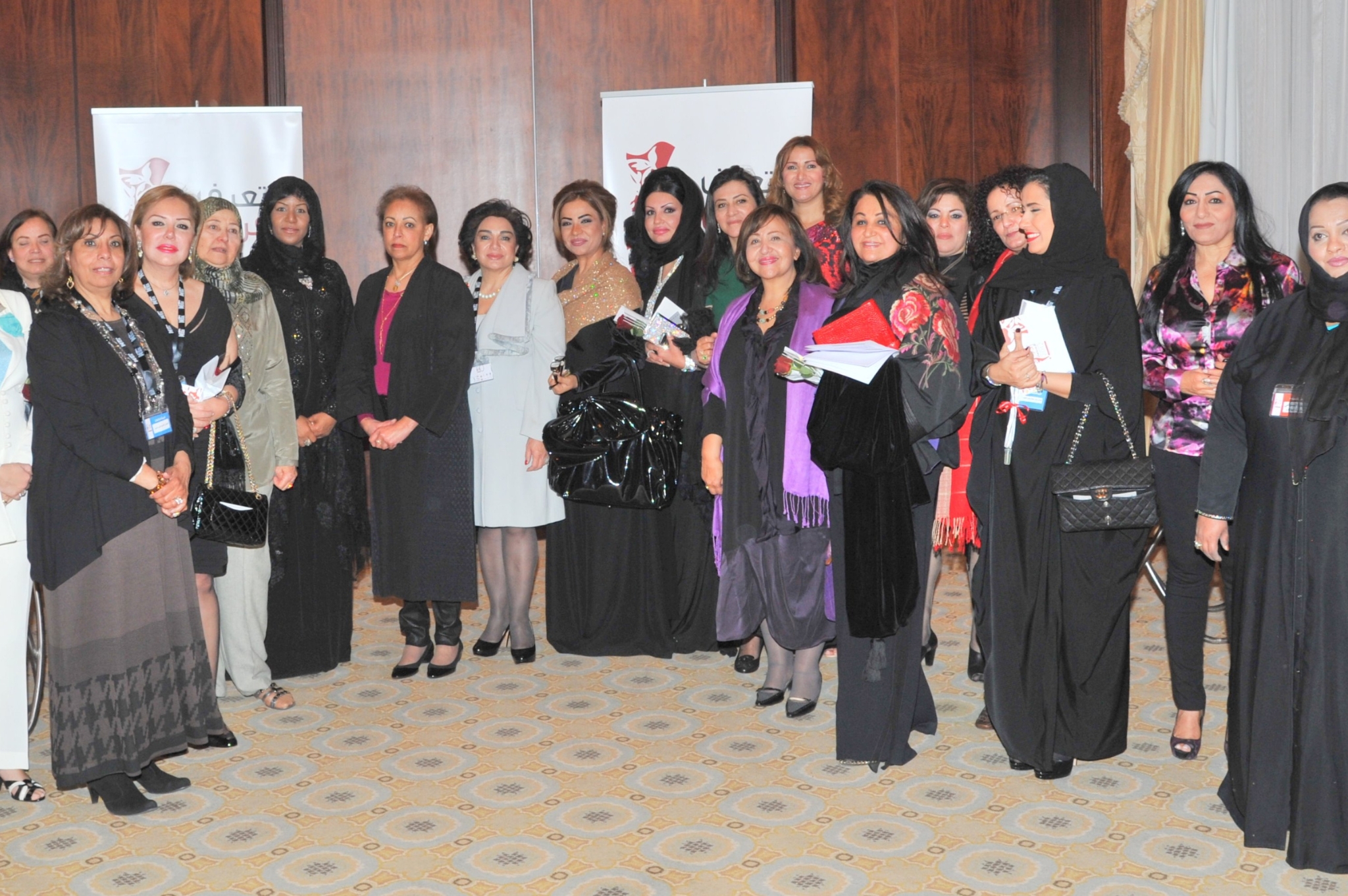 Curving forest road lined with tall pines.