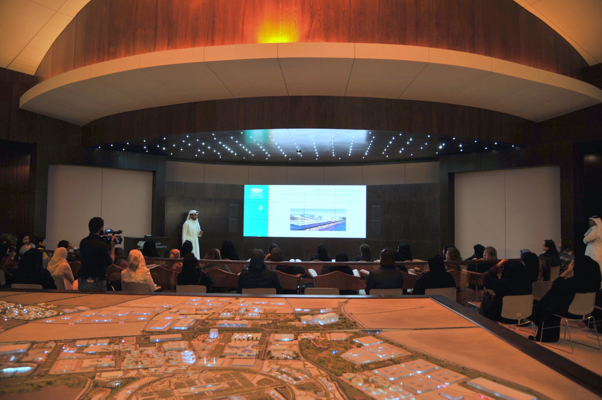City skyline at sunset with orange glow.