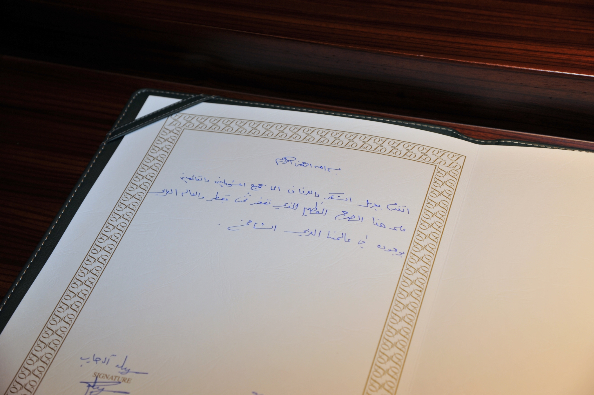 City skyline at sunset with orange glow.