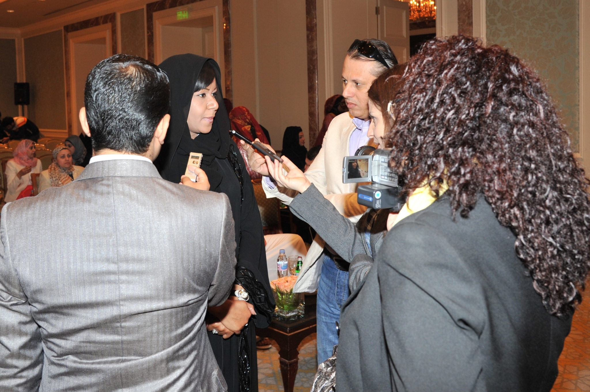 Curving forest road lined with tall pines.
